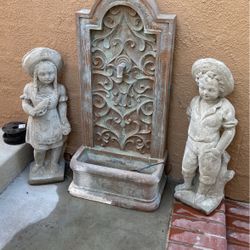 Little boy, little girl statues out of concrete