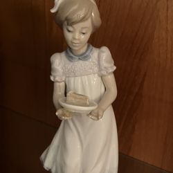 Lladro-girl holding piece of cake, cute!