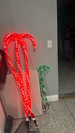 4feet tall red candy canes and 2ft green candy canes