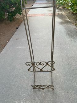 Vintage metal scrollwork magazine rack