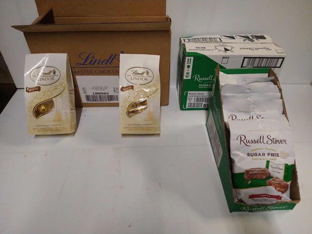 Lindt white chocolate balls 3.00 ea Suger Free Russell Stover milk chocolate bites . 2.00 ea or 15.00 fir case if 8 bags