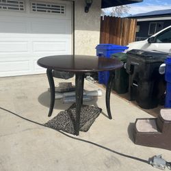 Round Dining Table with Long Curved Legs – Dark Wood Finish