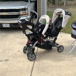 Double Stroller With Car Seat, Car Seat And A Bassinet.