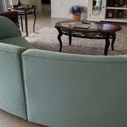 2 Piece Curved Sectional.  Good Condition.  112 Inches.  Beautiful, Unique Piece .