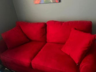 Large red loveseat couch