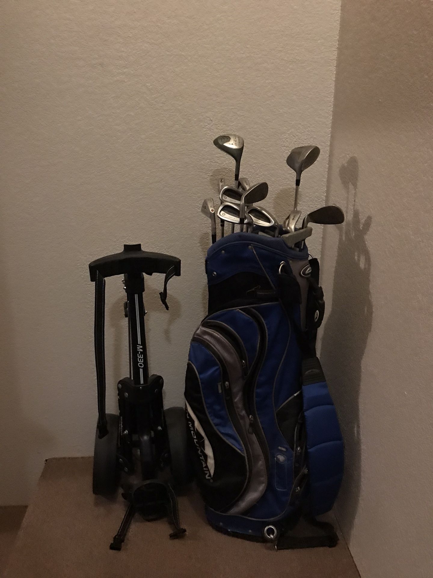 Golf clubs with caddy cart