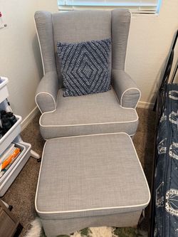 Rocking swivel chair with rocking footrest