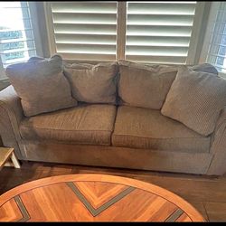 Tan loveseat couch