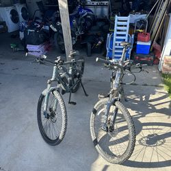 Man And Woman’s Raleigh Electric Assist Mountain Bikes 