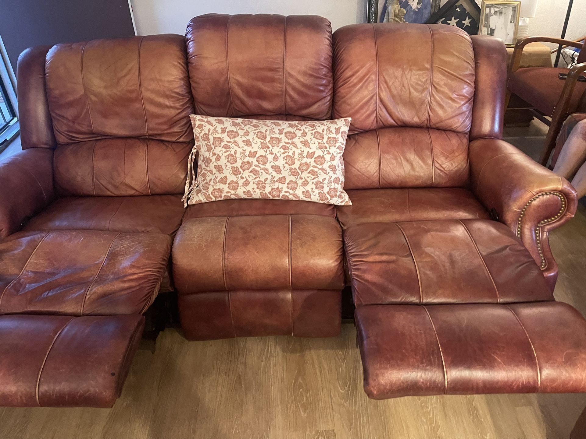 Rust colored  brown Leather  reclining Sofa & love seat  Need to 