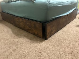 Queen bed frame w/ 4 roll out drawers