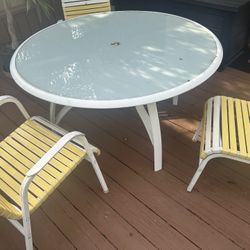 Outdoor set with 8 chairs and table 50” table approx. - 1 is longer chair and one is rocker