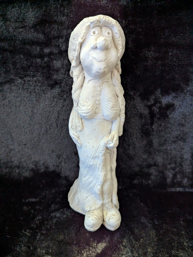 Statue Figurine Of Elderly Lady Showing Her Leg