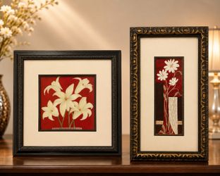 A set of 2 white flowers framed artworks for hanging on walls.