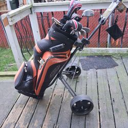 Set of golf clubs with bag & cart.