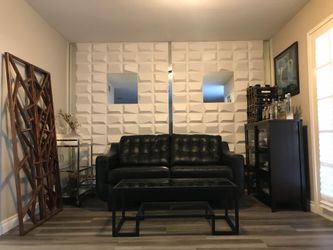 Faux leather love seat and metal/glass coffee table