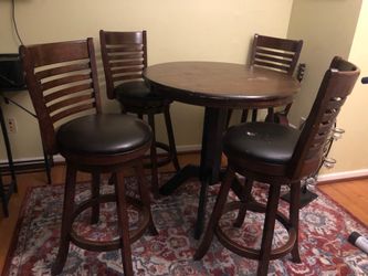 Bar table with four raised chairs