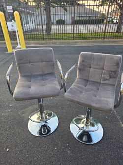 Pair of Grey velvet adjustable bar stools