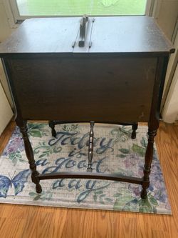 Old Sewing Cabinet. Has a couple Flaws. OBO
