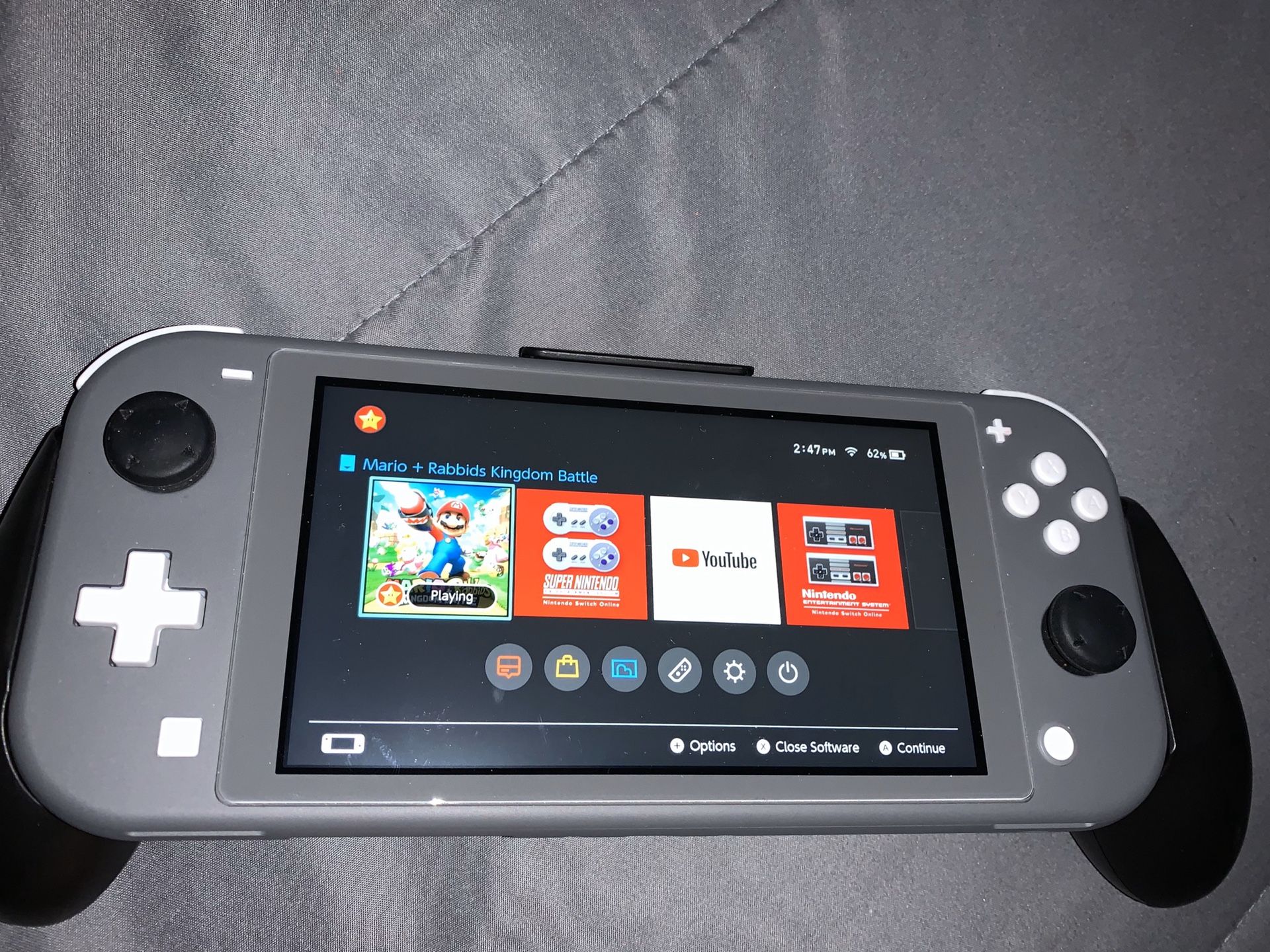 Nintendo Switch Lite (Grey) and Pokémon Sword game