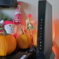 NETGEAR Nighthawk AX6 Model (CAX30) AX2700 Modem Router.