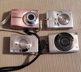 Four old digital cameras  $15 for all 4.