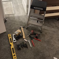 Various tools and step ladder