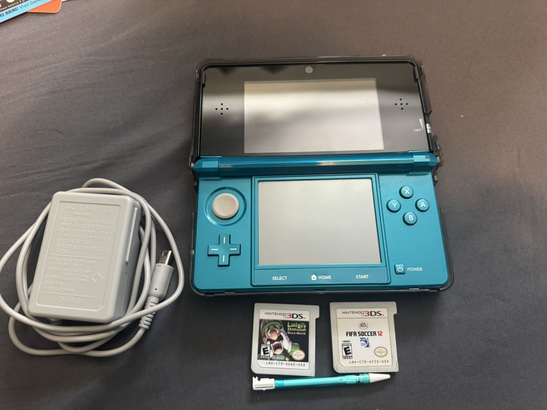 Nintendo 3DS Aqua Color With 2GB SD, Stylus And Charger Included Along With 2 Games