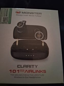 New Still sealed. Ear buds with charging station