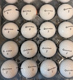 24 Like New TaylorMade Golf Balls As Pictured ———