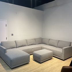 Used large gray sectional sofa couch with ottoman