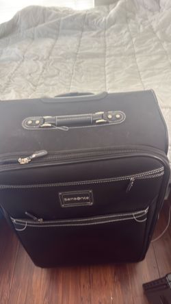 28” black Samsonite suitcase