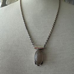 Vintage 925 sterling beige stone pendant with swirl chain necklace  Chain is marked and 24 inches long  Pendant is marked and approx 1.5” x .0.75” 24.