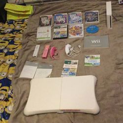 8 Wii Games 4 Wii Controller 5 Wii Instruction Booklets Wii Fit Balance Board Wii Console 