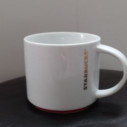 Starbucks Coffee 2012 White Red Bottom Ring Gold Letters Coffee Mug 16 Ounces

