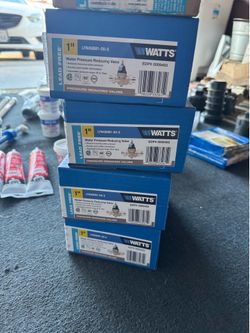 1 inch Moen water pressure regulators along with a variety of plumbing supplies
