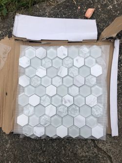 Beautiful glass mosaic 3sqf can be used for accent in ur shower or kitchen that's what we used for! The cracked tiles is design so it's not cracked a
