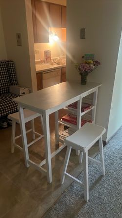 White kitchen table and stools with shelves