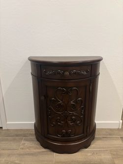 Dark Wood Demilune Cabinet with Carved Detail