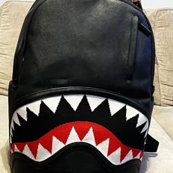 Sprayground shark-mouth knitted backpack