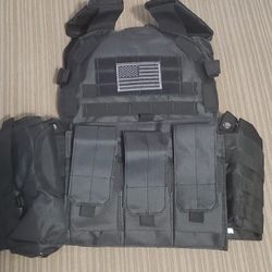 Brand New Tactical Vest With Tons Of Excessories And Can Hold Front and Back Plates ' NO Plates Included 