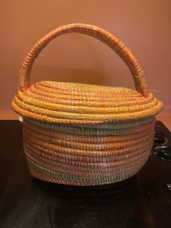 Handwoven coiled lidded basket