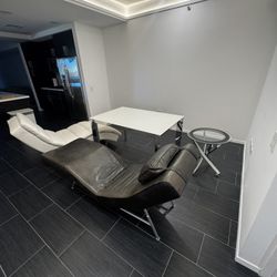 High End Glass Table And Leather Lounge Chairs