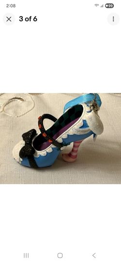 The Disney Parks Store Alice In Wonderland Runway Shoe Christmas Decoration Ornament is a collectible item inspired by the iconic character from the b