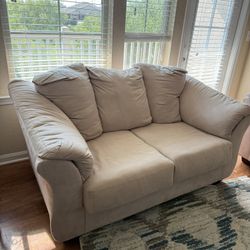 Two comfy loveseats in **great condition**.