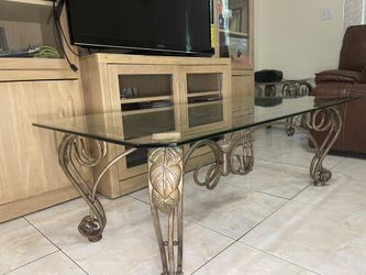 Glass Top Coffee Table with Decorative Iron Base – Good Condition