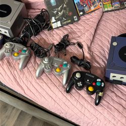 Nintendo Game Cube With The Games And Fike Controls