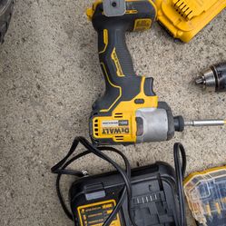 Cordless DeWalt impact and cordless Milwaukee drill.
