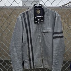 A vintage leather motorcycle jacket sized med