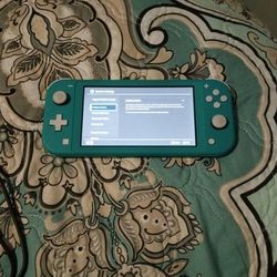 Nintendo Switch Lite, Two Games, Storage Card, Charger, And Case/Stand